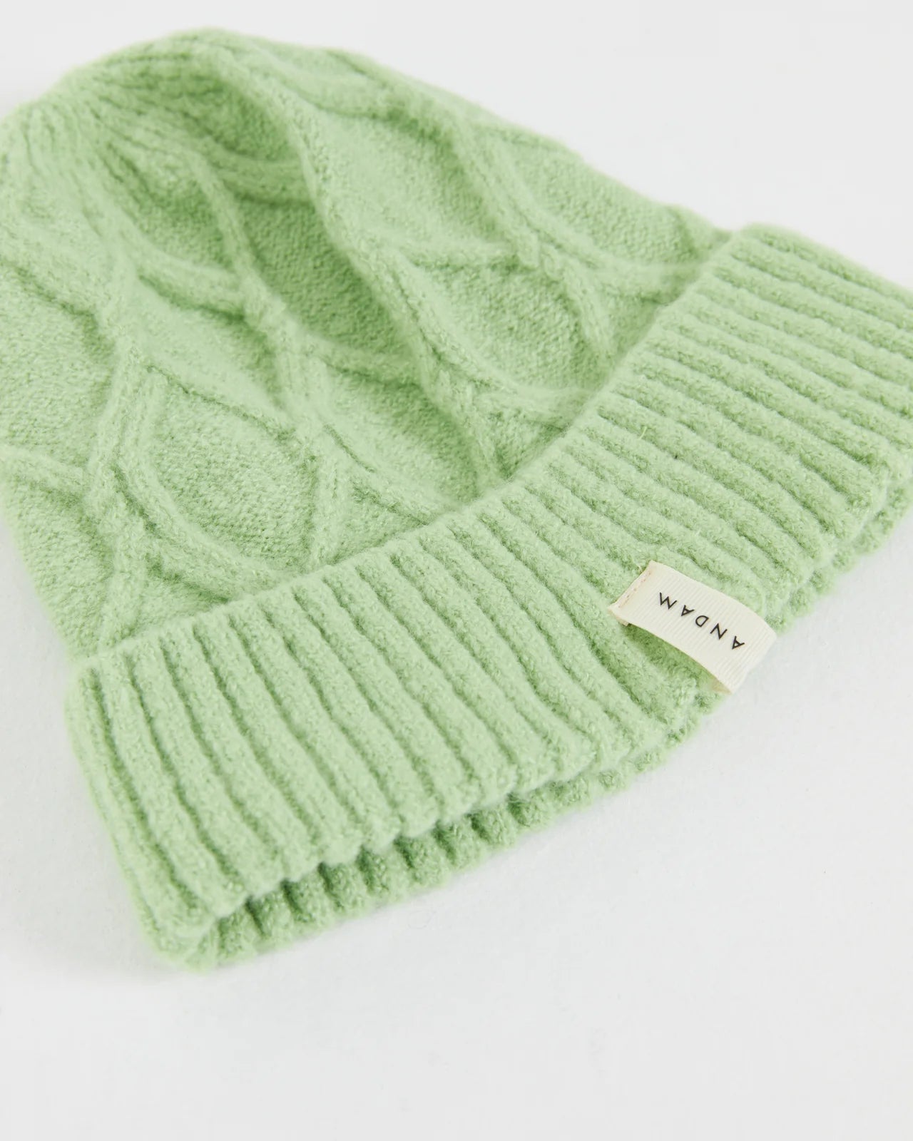 Andam, knitted hat with braided structure Green 0009